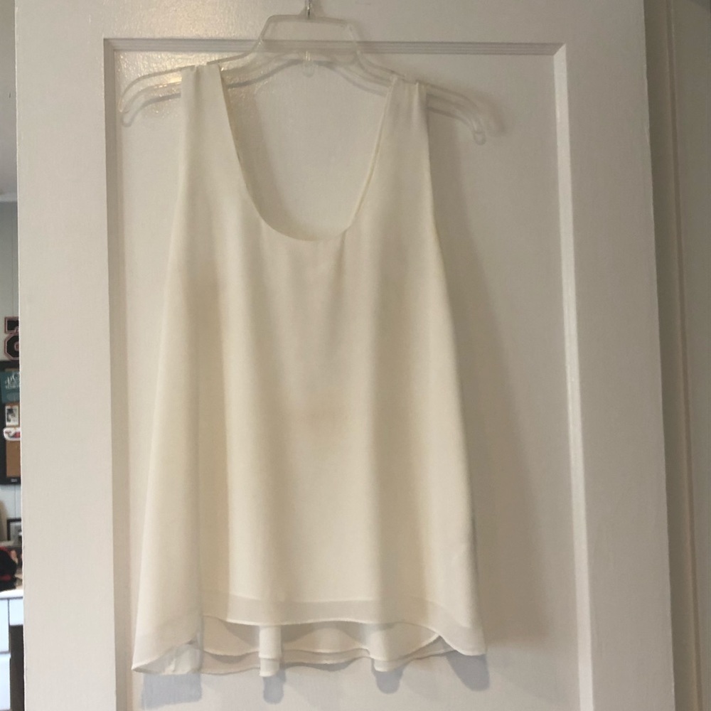 White top with detailed back. Like new.